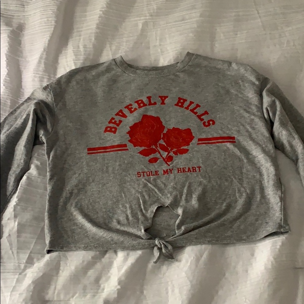 a long sleeve partially cropped shirt